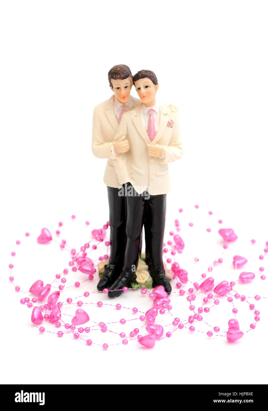 Una coppia omosessuale con un po' di Cuori rosa su sfondo bianco Foto Stock