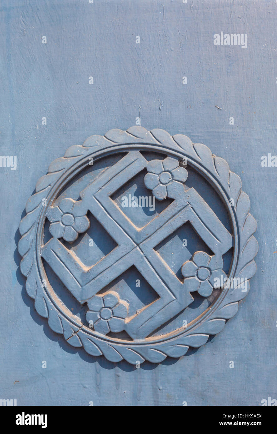 La svastica trovata nel subcontinente indiano, un simbolo sacro nell'Induismo, il Buddismo e il Giainismo Foto Stock