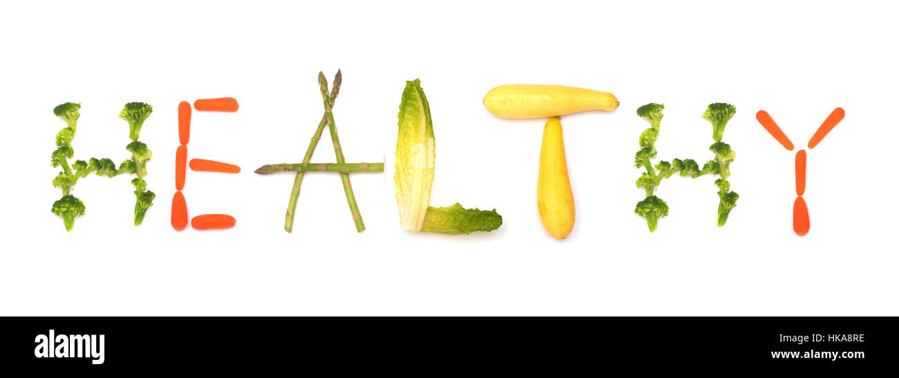 Sano - parola enunciato da verdure, concetto di mangiare più alimenti vegetali; su bianco Foto Stock