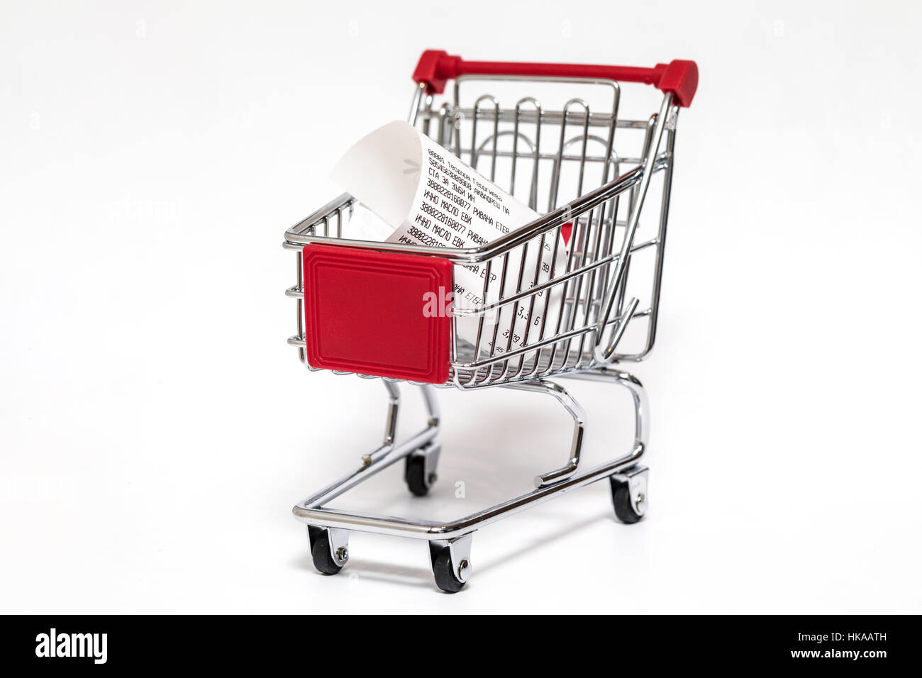 Carrello con ricevuta di cassa isolato su bianco Foto Stock