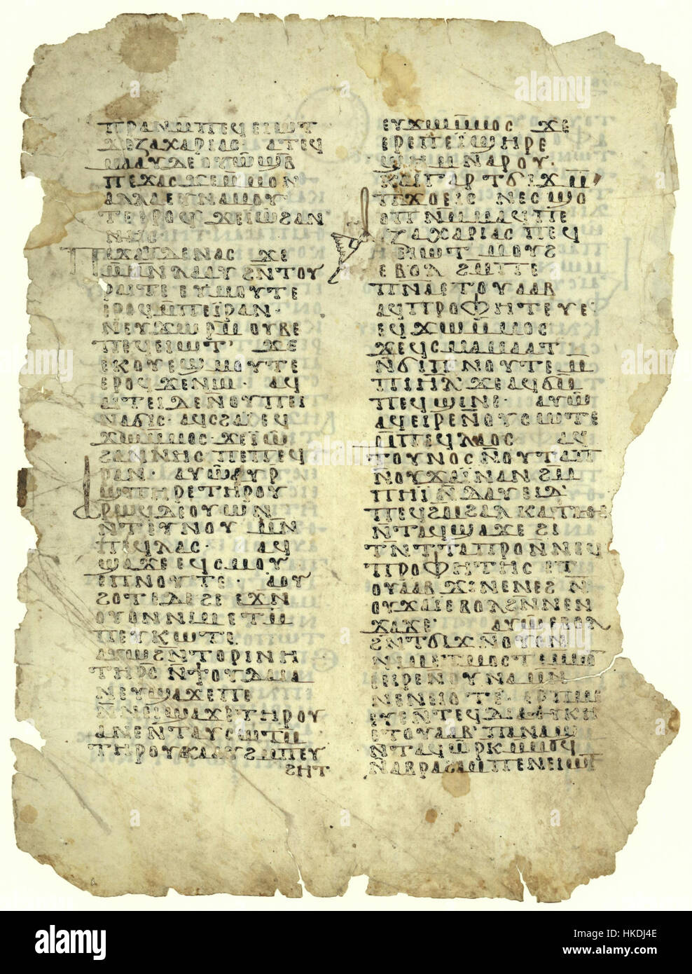 Questa pagina del manoscritto presenta una scrittura onciale dal Vangelo di Luca, in particolare i versetti 1:59-73. La scrittura è un esempio di calligrafia paleocristiana, usata nei testi religiosi durante i primi secoli. Lo stile di scrittura onciale, con le sue lettere arrotondate, era prevalente tra il IV e l'VIII secolo ed è spesso visto nei manoscritti biblici. Foto Stock