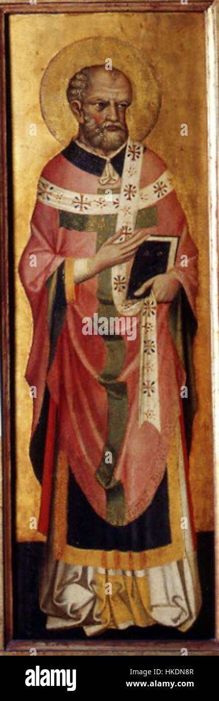 Santo sacerdote di Stefano di Sant'Agnese, situato nella Pinacoteca Nazionale di Ferrara, è un dipinto religioso che mostra un santo in posa solenne. Il pezzo riflette l'iconografia religiosa medievale. Foto Stock