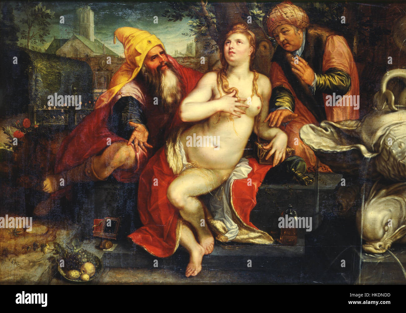 Questo dipinto di Hendrick Goltzius, 'Suzanna e gli anziani', raffigura la storia biblica di Suzanna, una donna falsamente accusata da due anziani. Goltzius, noto per le sue belle abilità incisive, ha catturato questo momento drammatico con i suoi dettagli caratteristici e il suo realismo, mettendo in evidenza l'interesse rinascimentale per l'arte narrativa. Foto Stock