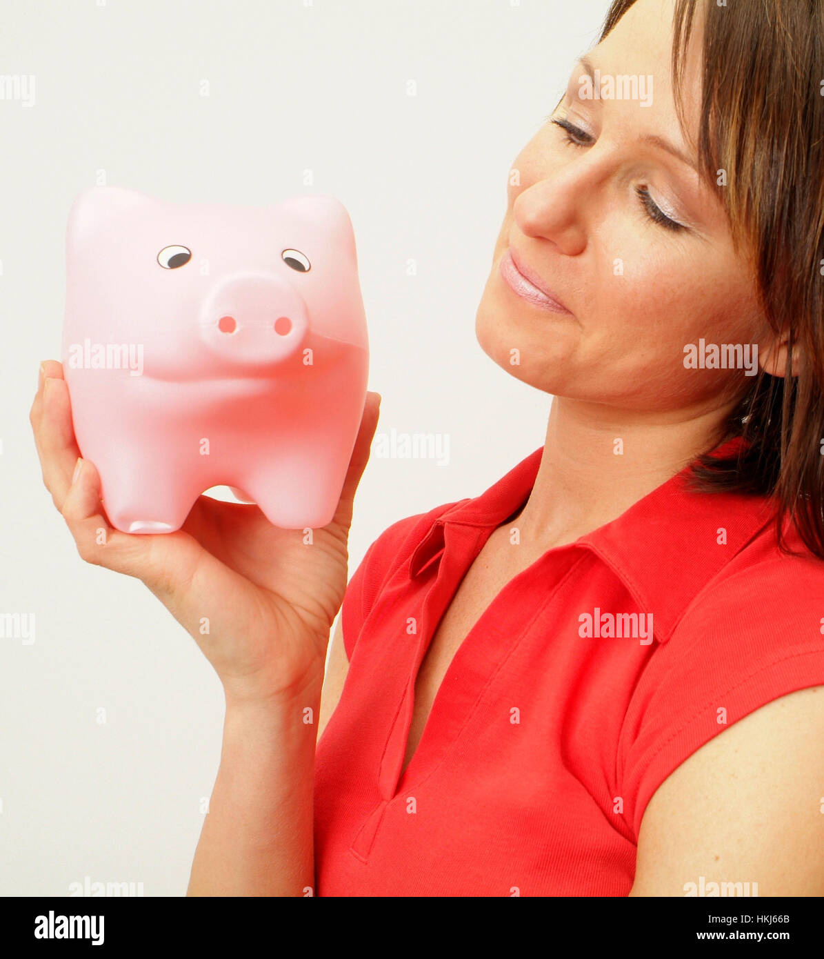 Giovane donna con il salvadanaio Foto Stock