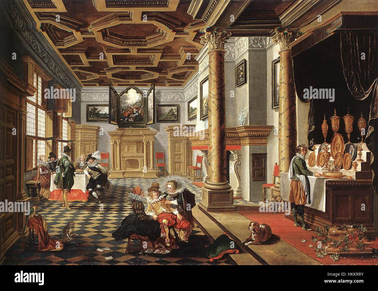 "Renaissance Interior with Banqueters" di Bartholomeus van Bassen cattura un'opulenta scena di una sala banchetti dei primi anni del XVII secolo. Il dipinto riflette la ricchezza e lo stile di vita sontuoso del tempo, mostrando arte rinascimentale e design degli interni. Foto Stock