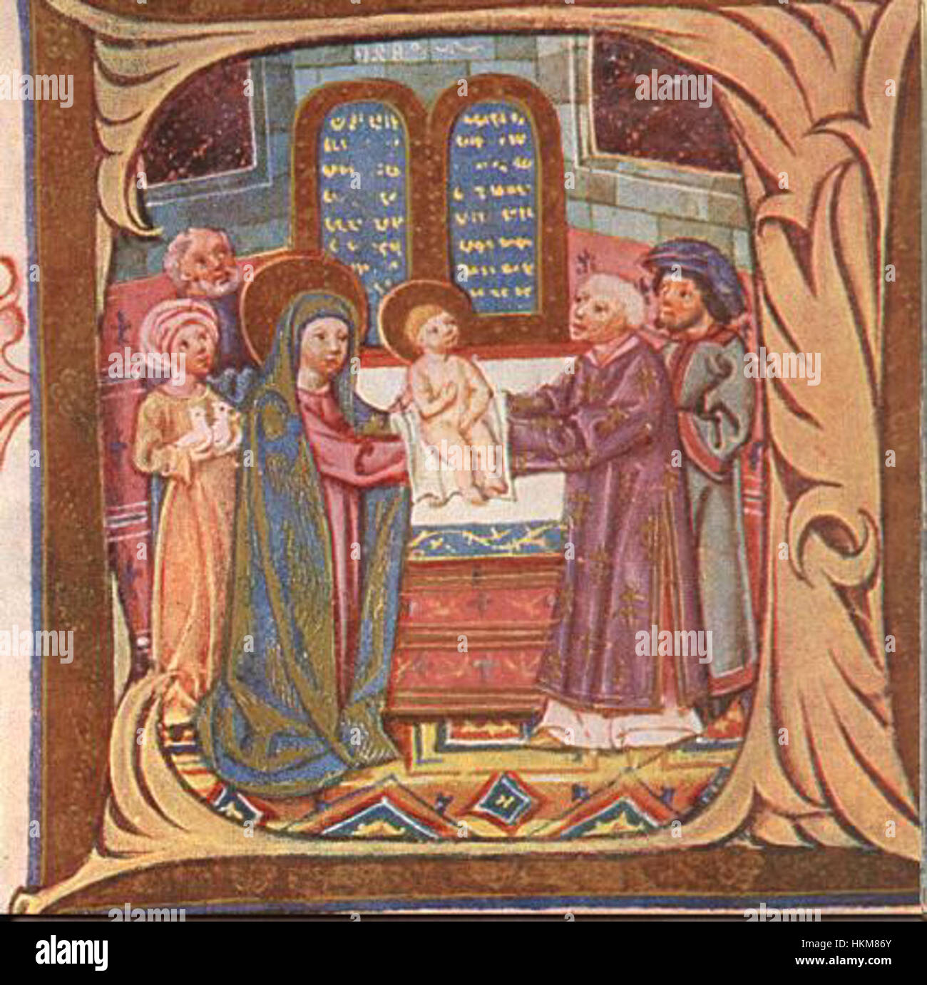 Una pagina dell'Evangelistarium altoatesino, creata da pittori del XV secolo, che mostra intricate illustrazioni religiose e scene bibliche, che rappresentano l'arte del tempo. Foto Stock