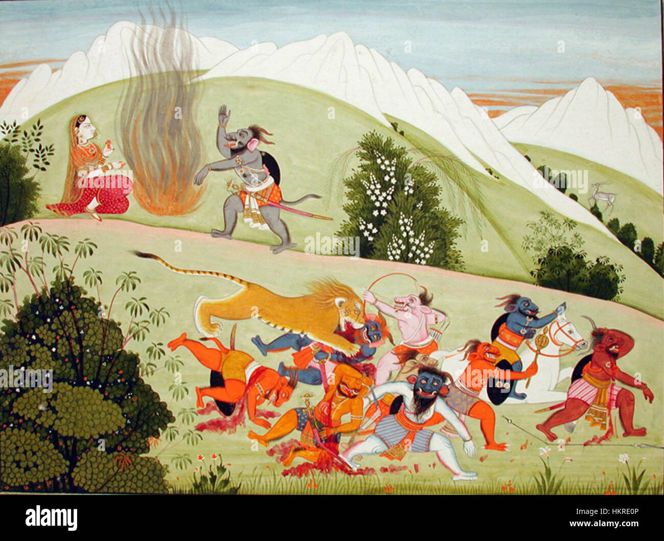 Questa opera d'arte illustra una scena della mitologia indiana in cui la dea Chandi sconfigge il capo demone Dhumra Lochana. Il vivido dipinto mostra il suo potere mentre lei lo riduce in cenere. Foto Stock