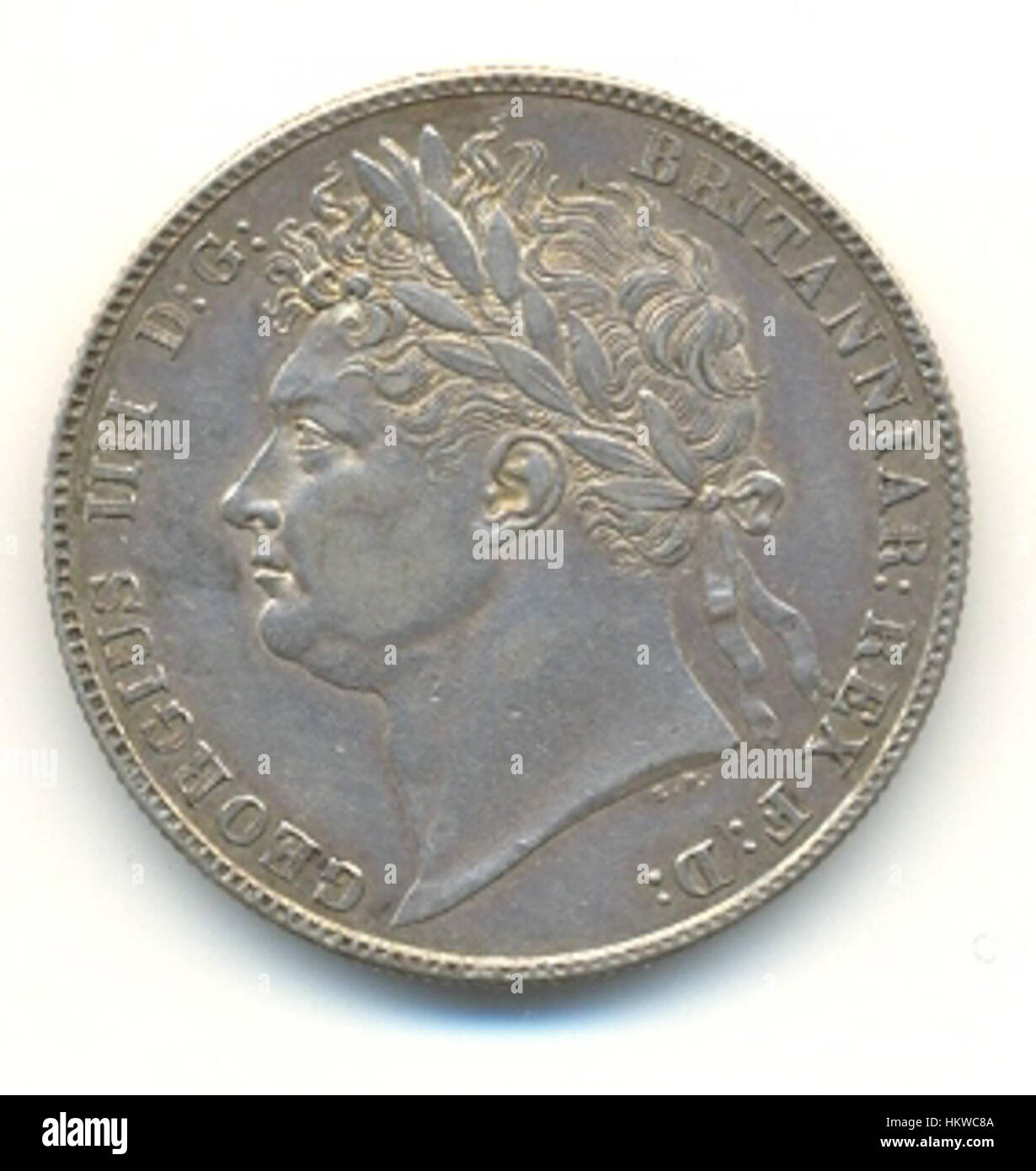 La moneta di Giorgio IV, prodotta durante il regno di re Giorgio IV del Regno Unito, è un pezzo storico della moneta britannica. Nota per il suo design dettagliato e le insegne reali, la moneta rappresenta le influenze economiche e artistiche dell'epoca all'inizio del XIX secolo. Foto Stock