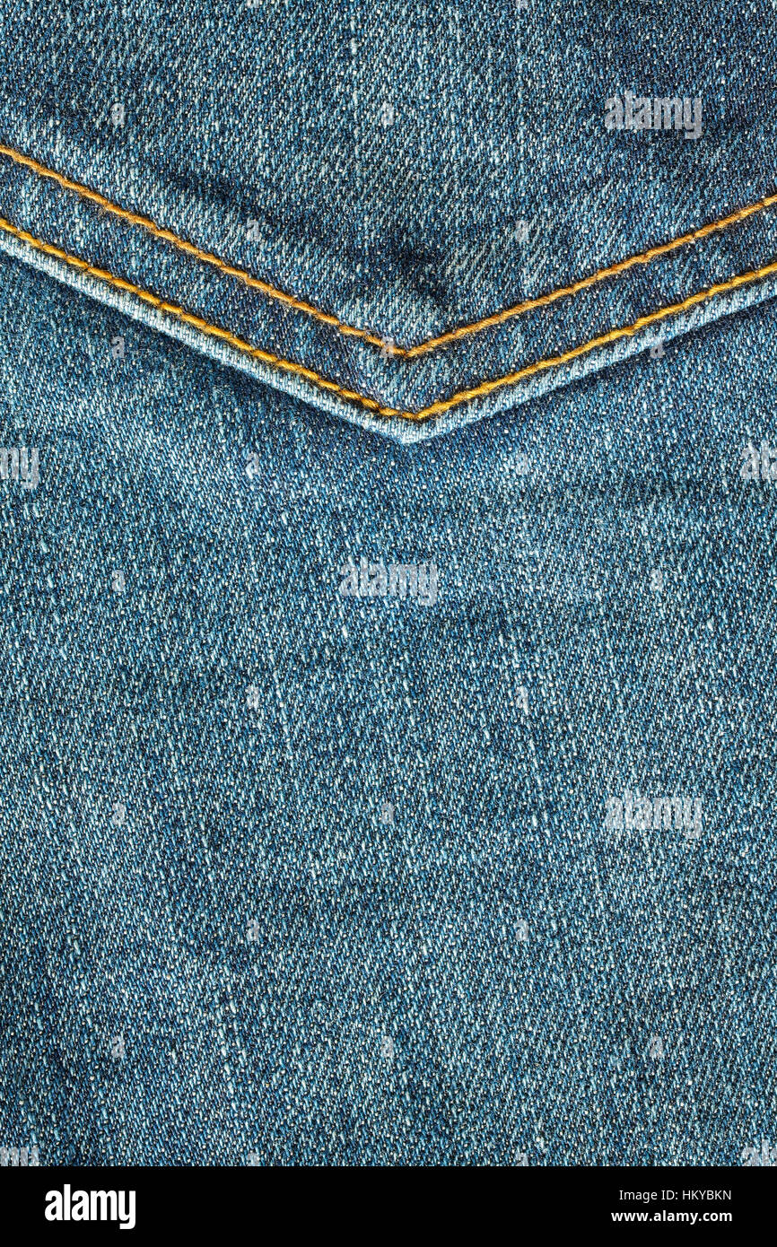 Close up foto di blue jeans tessuto con cuciture, sfondo o texture. Foto Stock