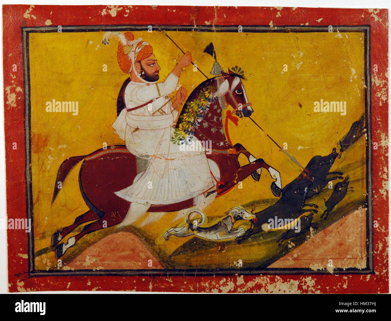 Gokaldas a cavallo del suo stallone, Lalparogh, in una scena di caccia al cinghiale, un dipinto storico che illustra la tradizione reale delle cacce in India. Foto Stock