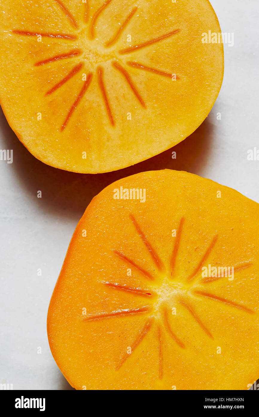 Due metà di Persimmon Foto Stock