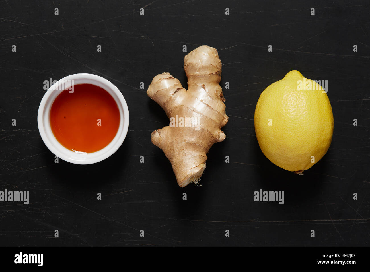 Ciotola con il miele, lo zenzero e limone Foto Stock