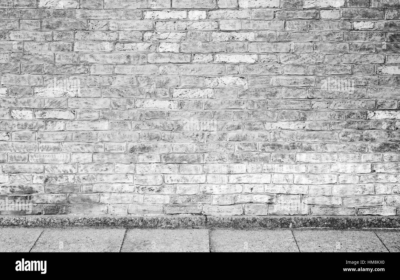 Abstract vuoti urbani interni con sfondo grigio a muro di mattoni e cemento piastrellisti Foto Stock