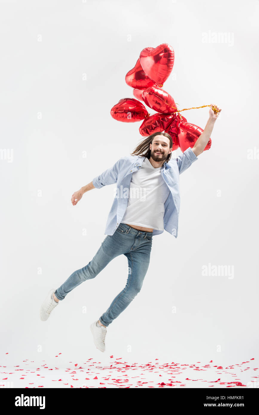 Uomo con palloncini di aria Foto Stock