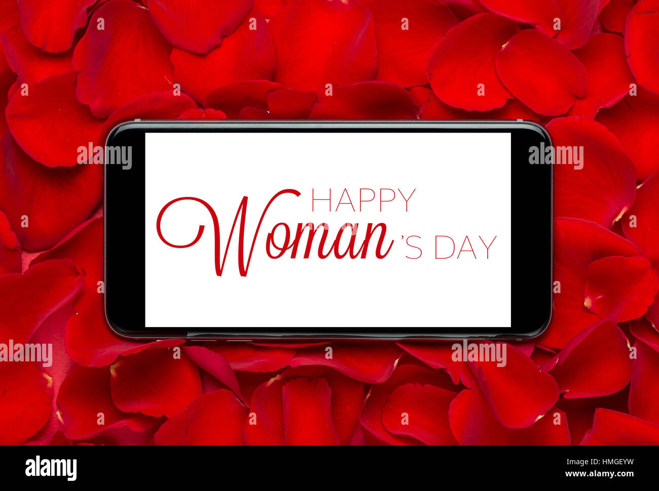 Rose con 8 Marzo Internazionale Womans giorno su schermo mobile. Foto Stock