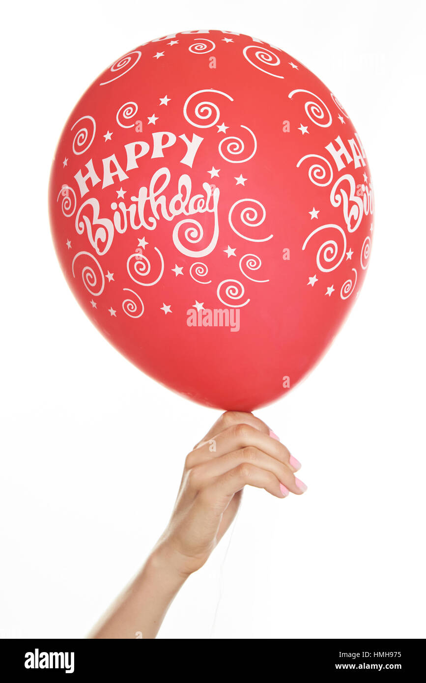 Il palloncino rosso in mano con isolato su bianco Foto Stock