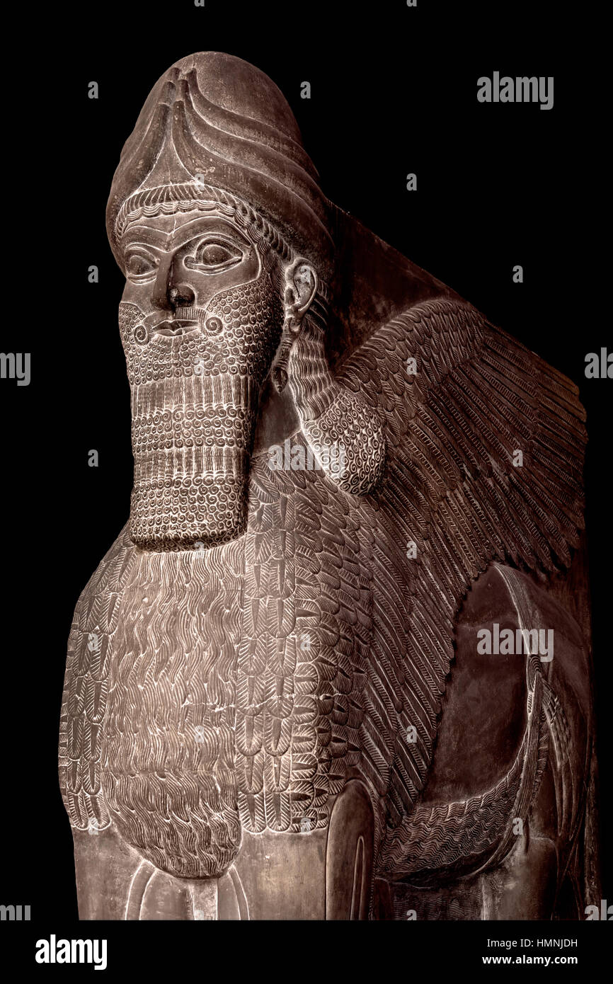 Lamassu assiro (umana con testa di toro alato), Ninive antica città della Mesopotamia superiore, (Mosul Iraq) capitale Neo Impero Assiro, (l'Assiria 2500 BC-612 BC) Foto Stock