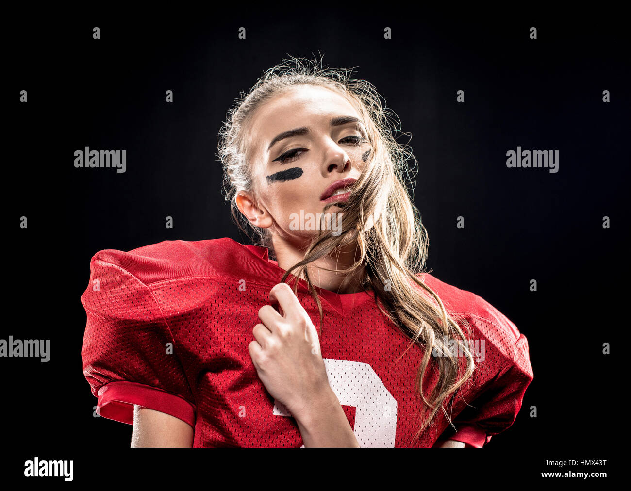 Femmina attraente giocatore di football americano Foto Stock