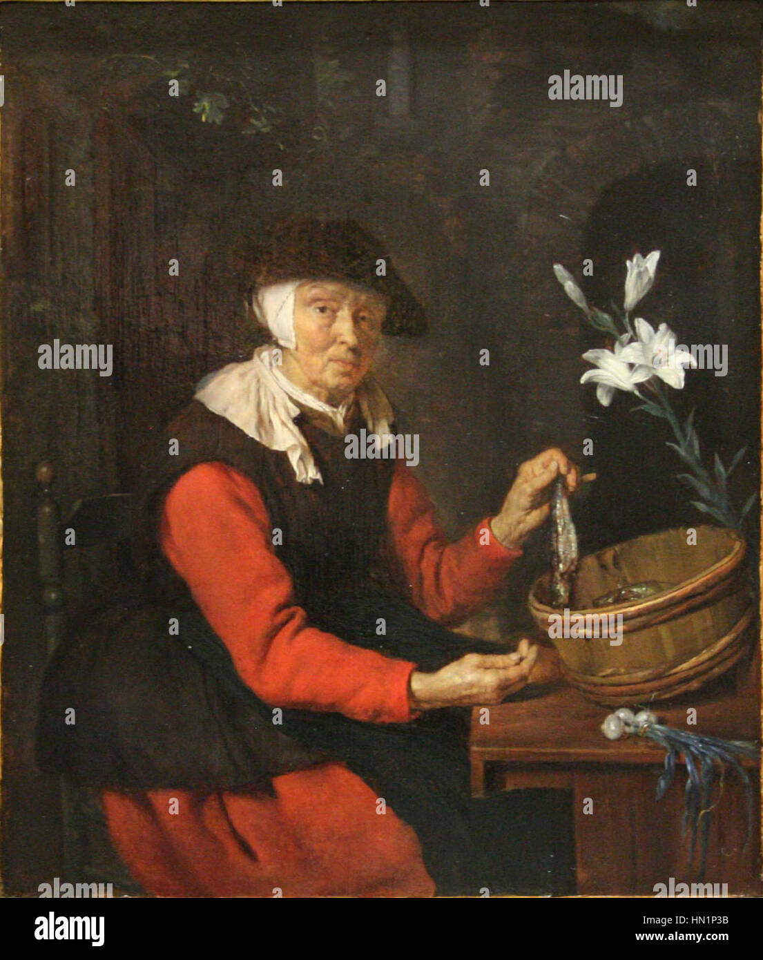 "Marchand de harengs" di Metsu è un dipinto di genere olandese del XVII secolo che raffigura un mercante di aringhe in un vivace mercato. L'opera sottolinea la vita quotidiana e il commercio del tempo, mostrando l'attenzione dell'artista al realismo e al contesto sociale. Foto Stock
