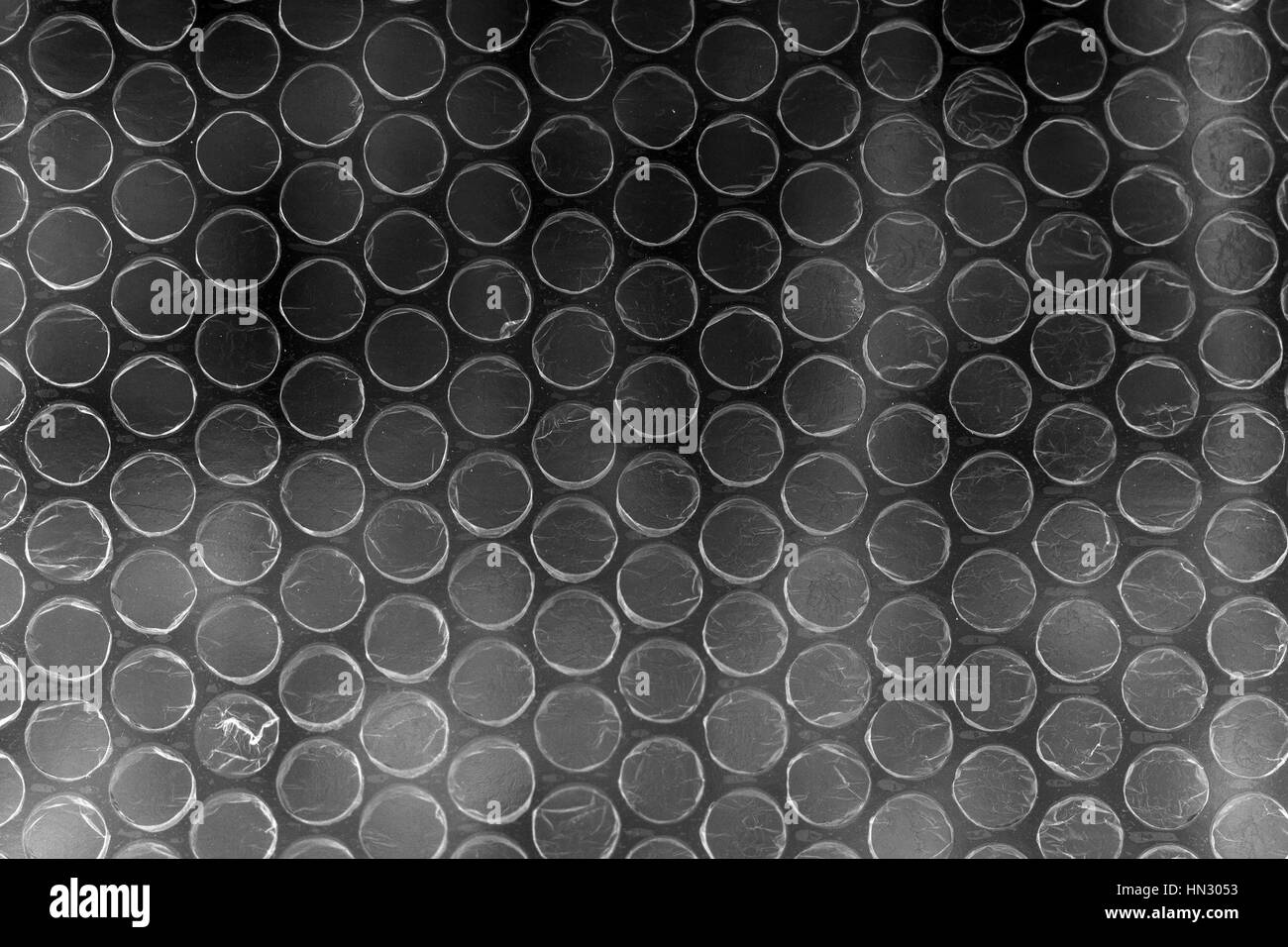 Polimero di plastica a bolle in alto contrasto vivido colore grigio scuro Foto Stock