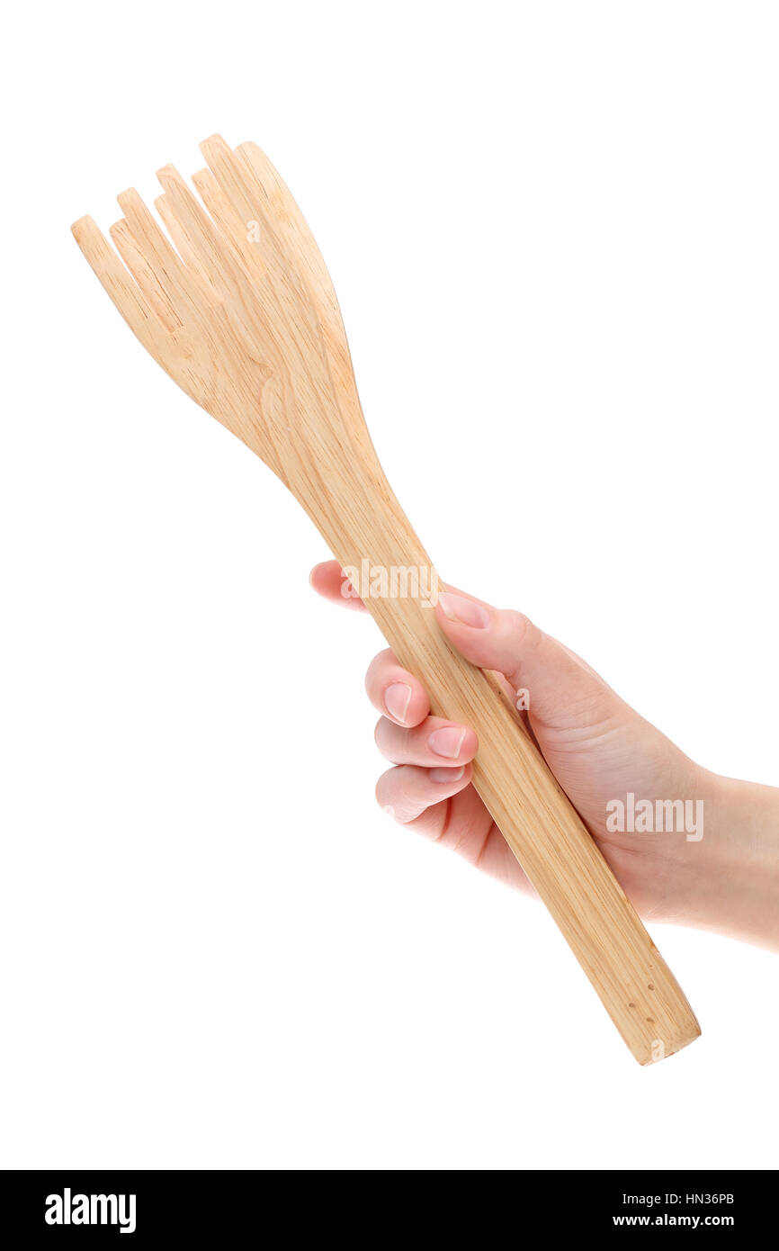 Mano azienda cucina in legno pinze isolate su uno sfondo bianco Foto Stock