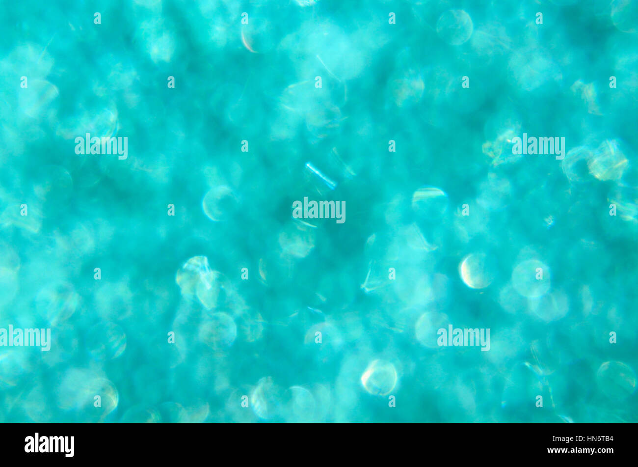 Sfondo bokeh di luce verde blu aqua vetro macchiato Foto Stock