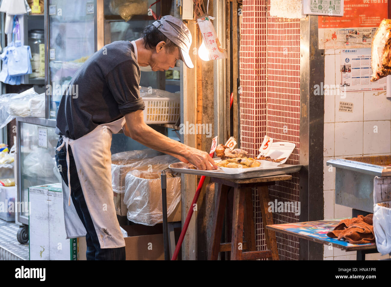 Una macelleria sulle strade di Mong Kok del distretto di Hong Kong Foto Stock