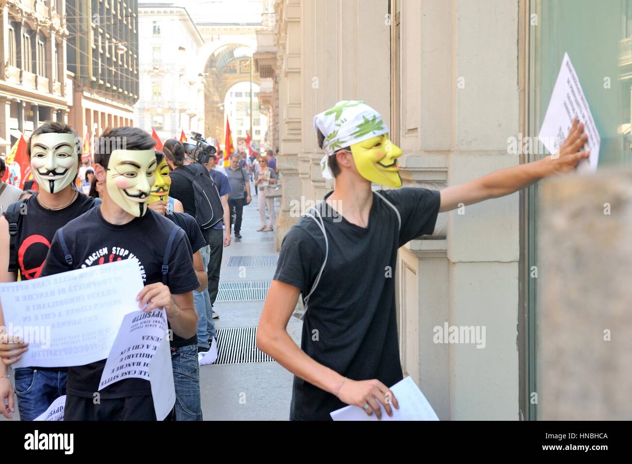 Anonimo a protester contro austerità per la dimostrazione Foto Stock