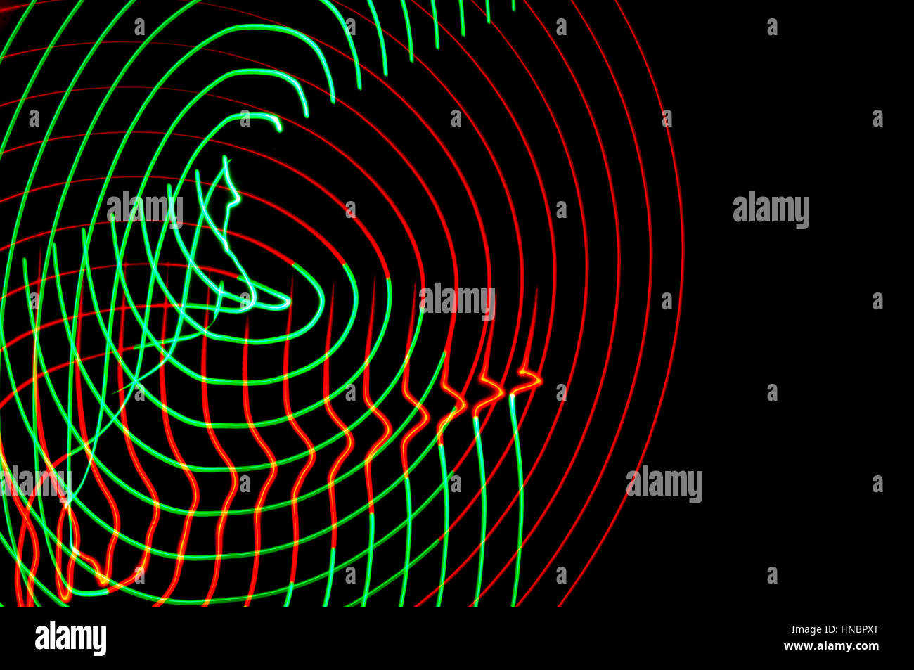 La pittura di luce. Abstract, futuristico, colorato con esposizione lunga, sfondo nero-12. Foto Stock
