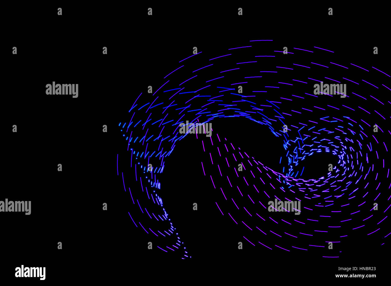La pittura di luce. Abstract, futuristico, colorato con esposizione lunga, sfondo nero-40. Foto Stock