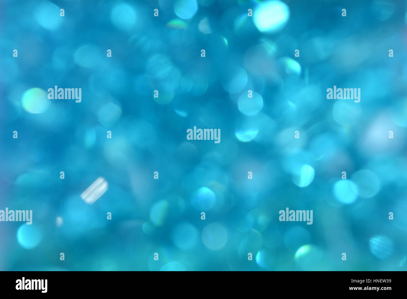 Blu sfondo bokeh di fondo. Abstract di festa con sfondo bokeh luci. Blu luce di Natale. Nuovo Anno di texture Foto Stock