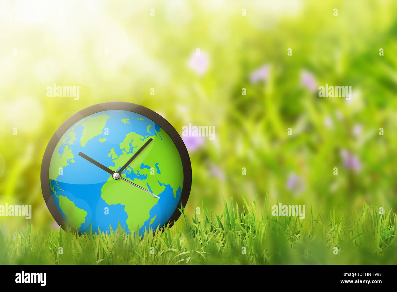 Orologio della terra nel campo. Earth Hour concetto. Foto Stock