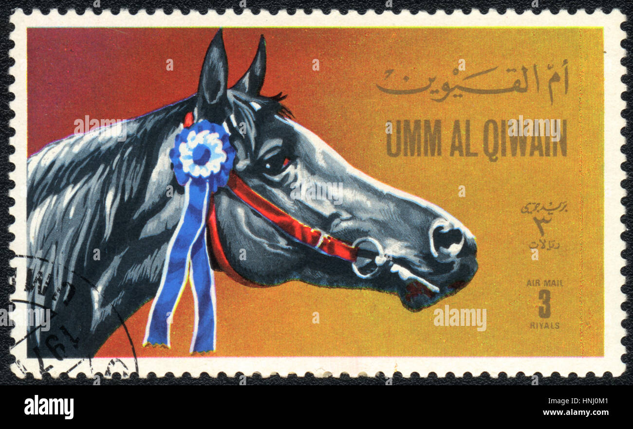 Un francobollo stampato in Umm al-Qiwain mostra un cavallo grigio , 1971 Foto Stock