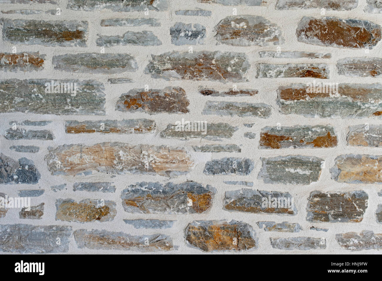 Close-up di un tradizionale muro di pietra in Grecia Foto Stock