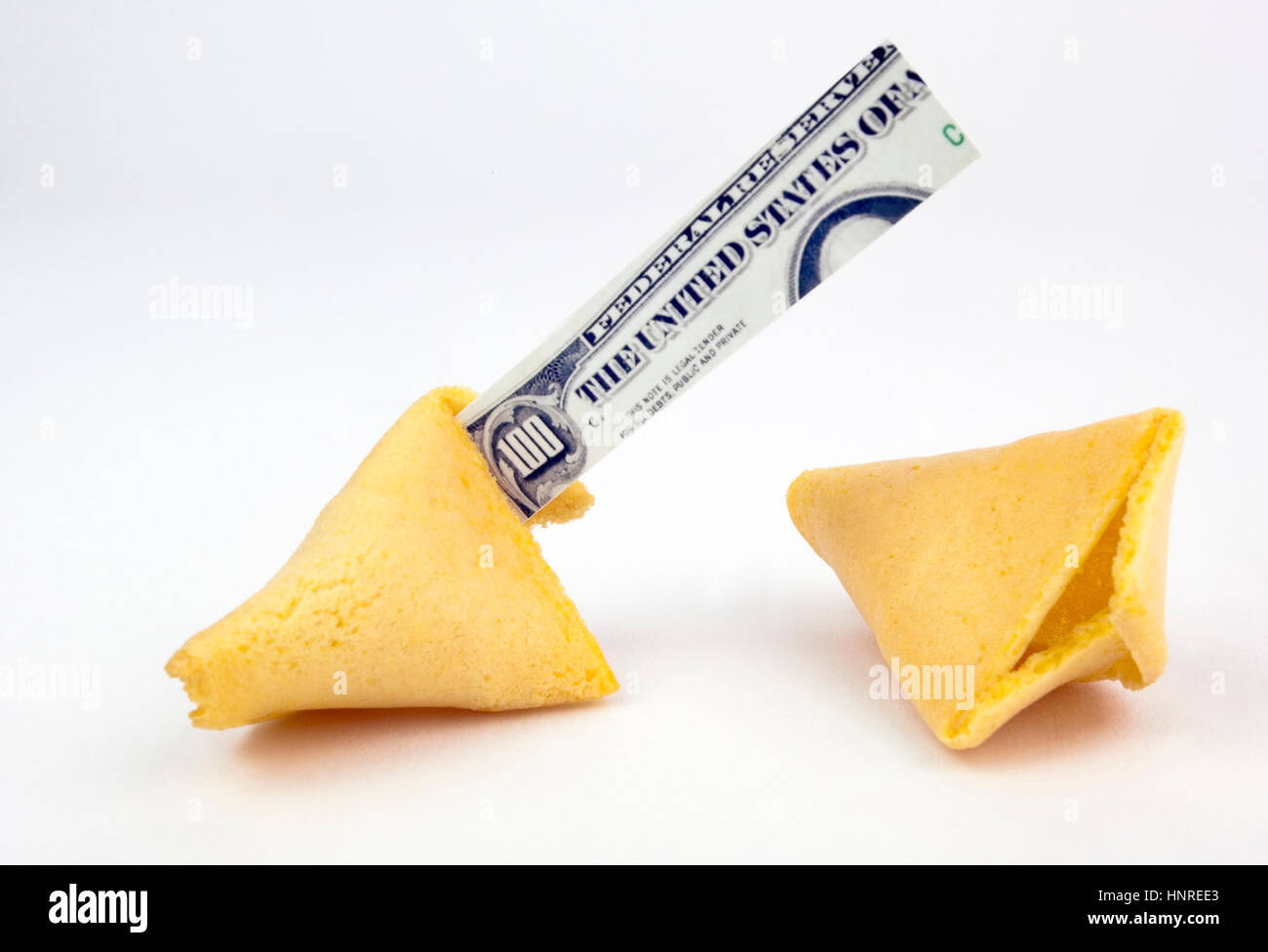 Un centinaio di dollari in un aperto rotto Fortune cookie. Foto Stock