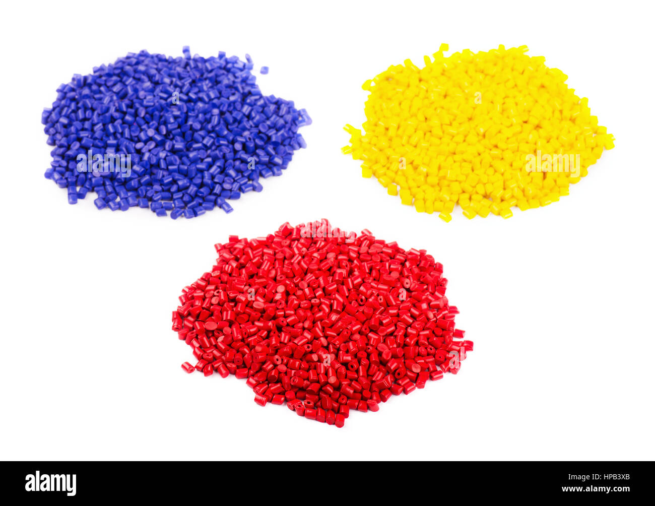 In plastica colorata dei granuli di polimero isolato su sfondo bianco Foto Stock