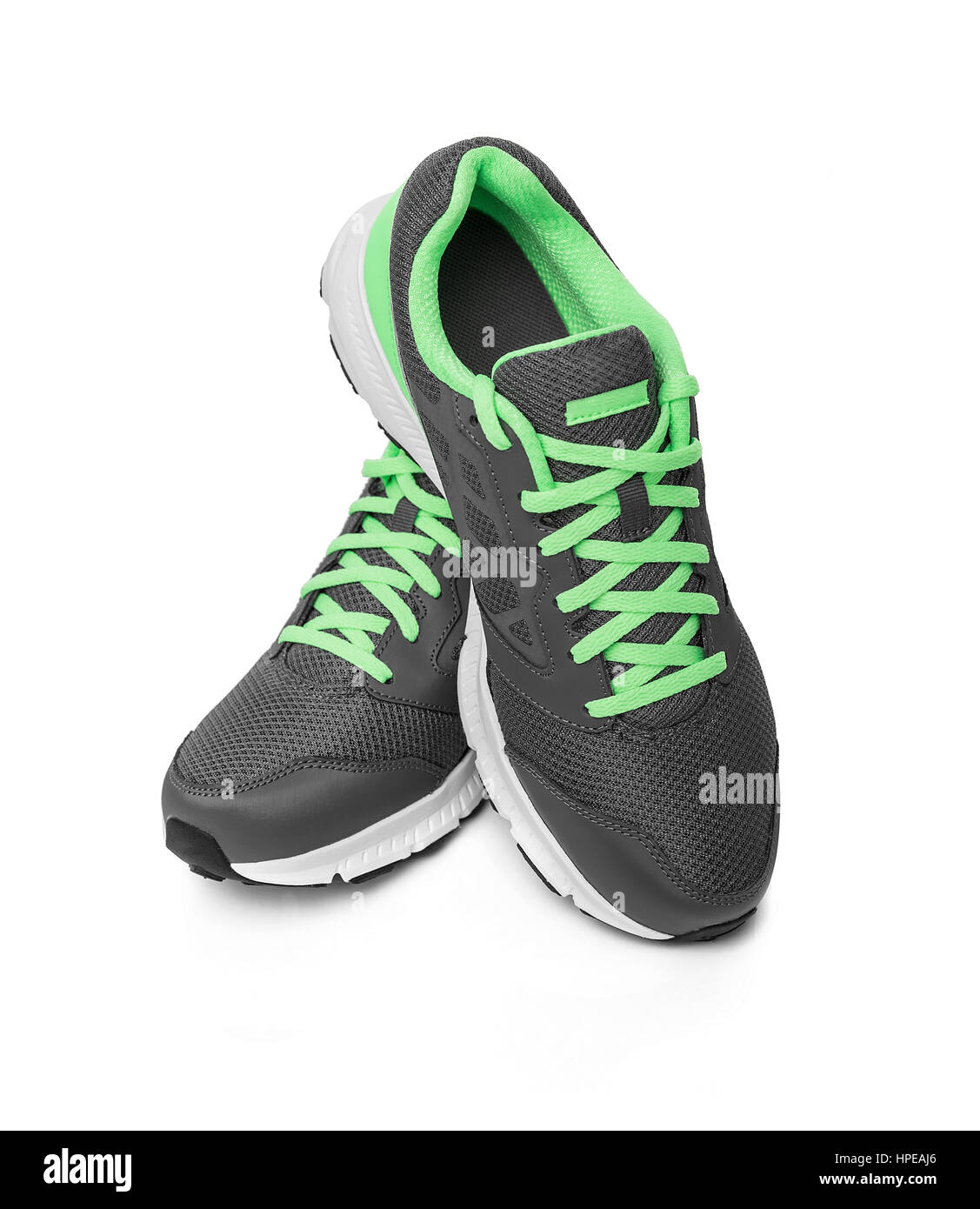 Senza marchio sneakers moderno isolato su uno sfondo bianco. Lime o verde sneakers. Foto Stock