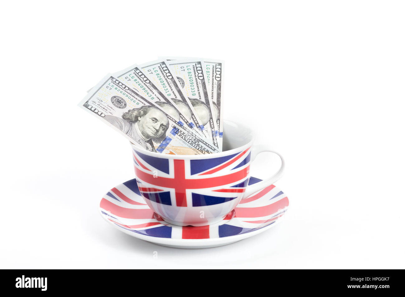 Centinaia di fatture del dollaro in una tazza dipinta come Union Jack flag Foto Stock