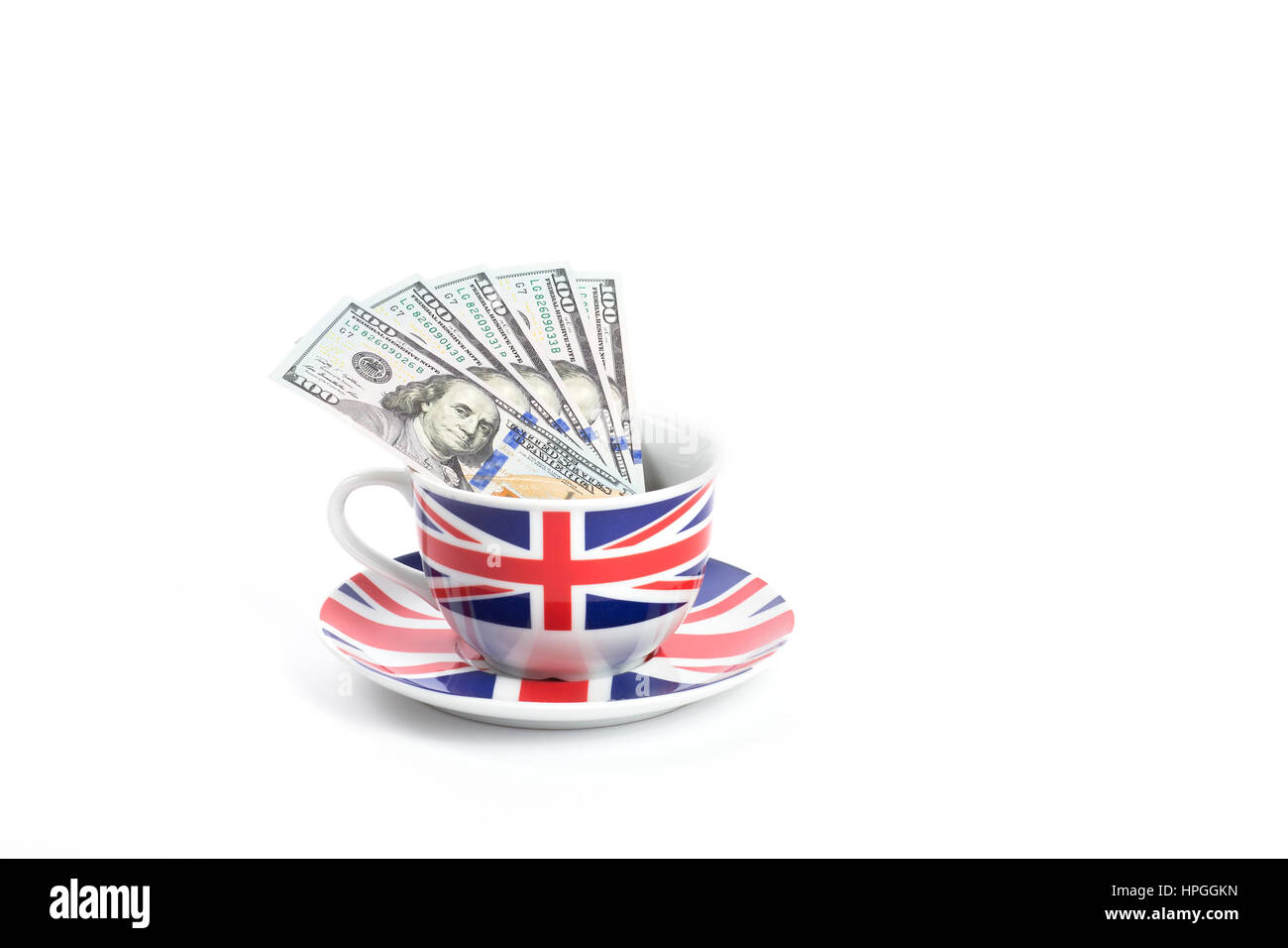 Centinaia di fatture del dollaro in una tazza dipinta come Union Jack flag Foto Stock