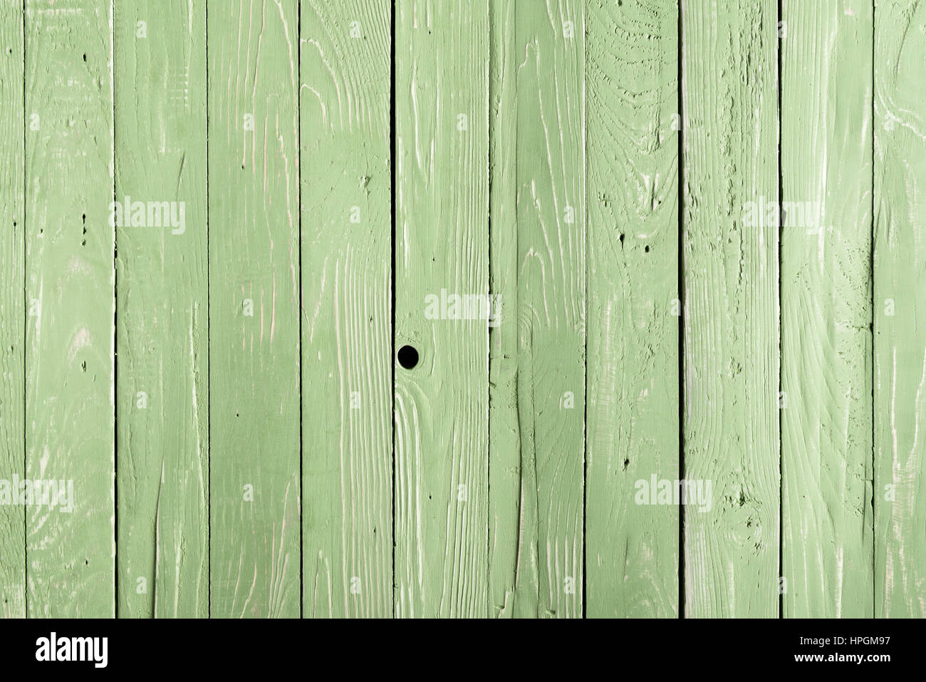 Verde sullo sfondo di legno con tavole verticali Foto Stock