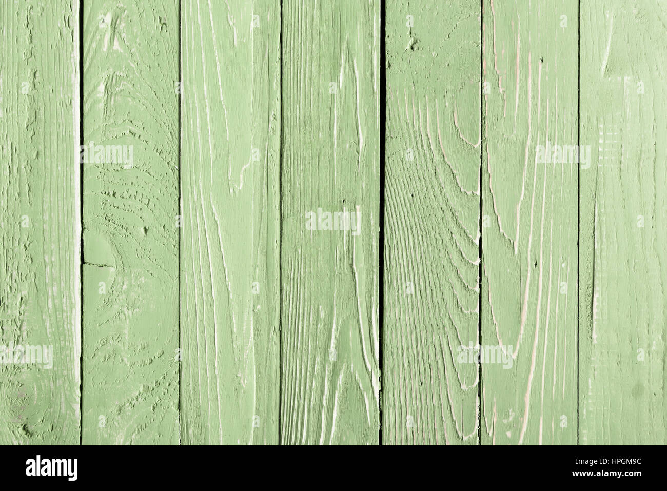 Verde sullo sfondo di legno con tavole verticali Foto Stock