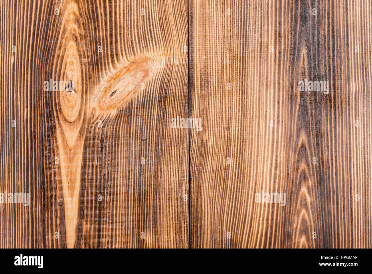 Telaio della luce marrone rustico sfondo di legno con tavole verticali Foto Stock