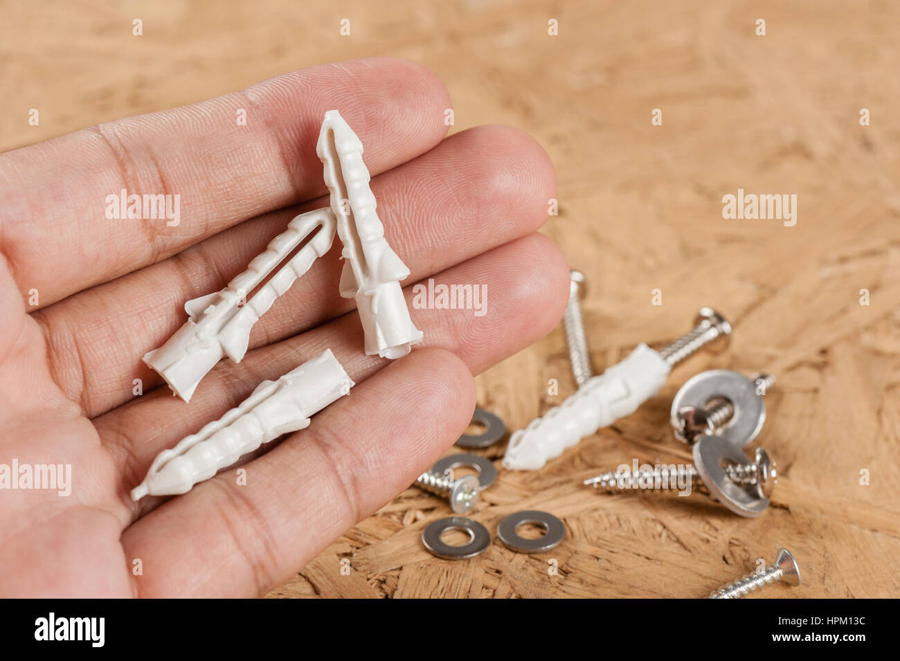 Plastica Closeup a cavallo di grano in mano Foto Stock