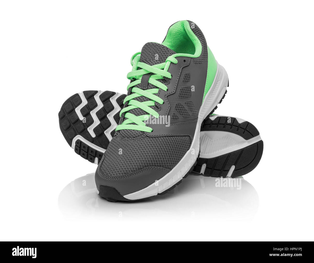 Senza marchio sneakers moderno isolato su uno sfondo bianco. Lime o verde sneakers. Foto Stock