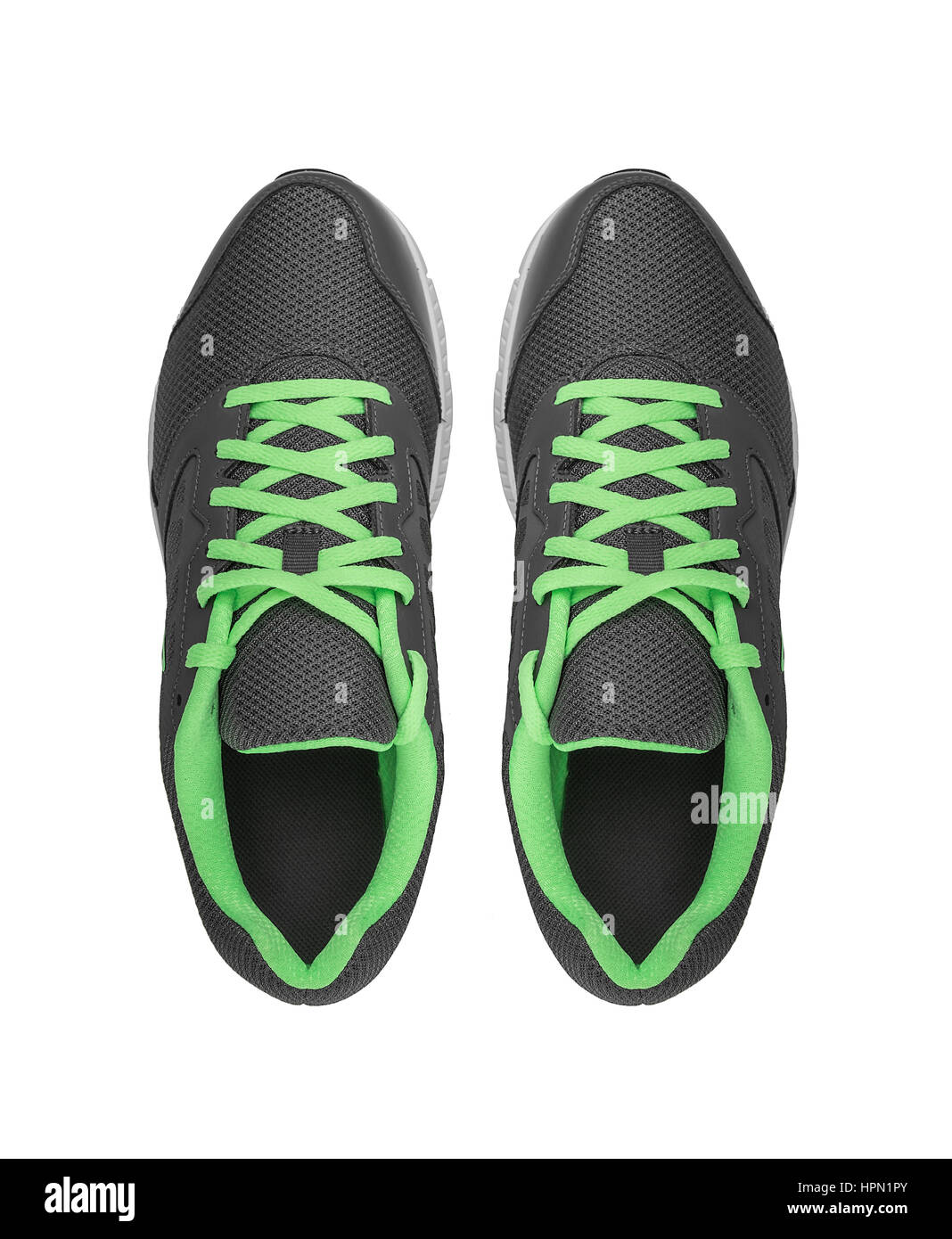 Senza marchio sneakers moderno isolato su uno sfondo bianco. Lime o verde sneakers. Foto Stock
