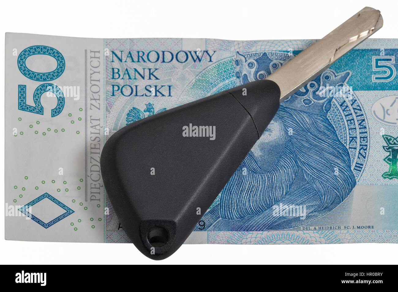 Le chiavi dell'auto sul zloty polacco banconota background closeup isolato su bianco Foto Stock