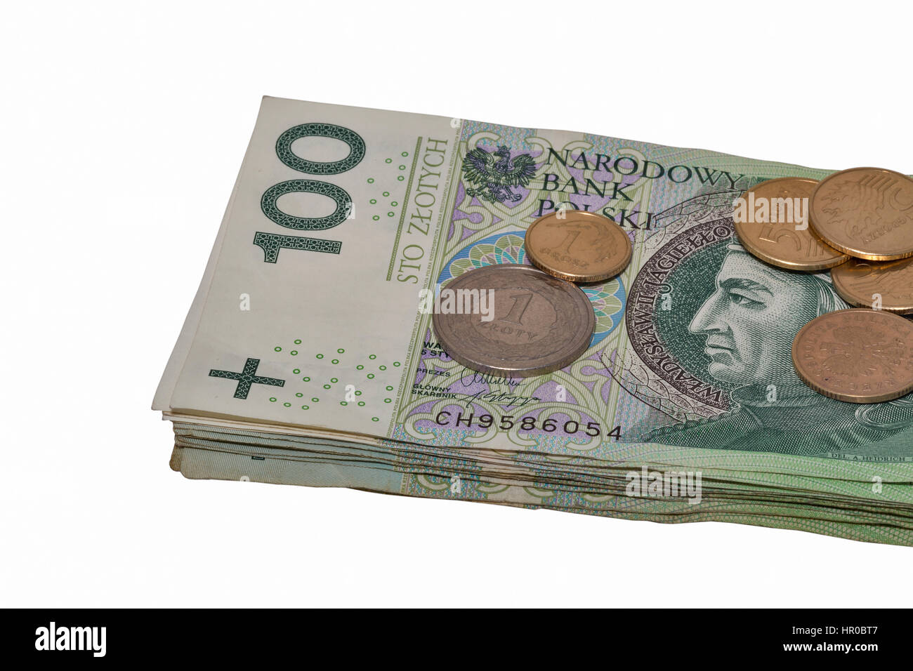Il polacco utilizzato banconote di un centinaio di stack e monete isolati su sfondo bianco Foto Stock