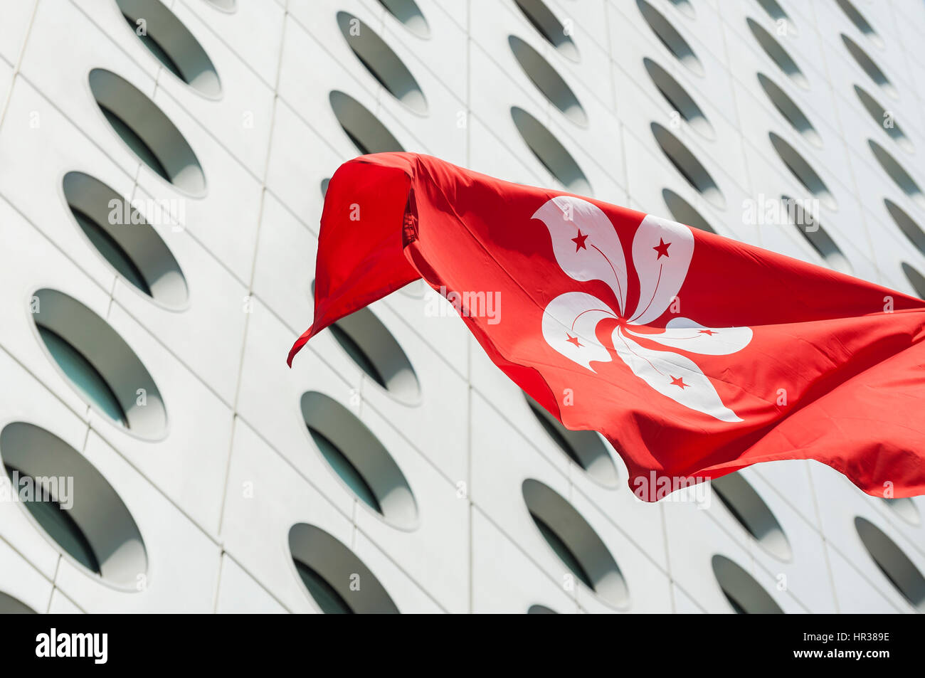Hong kong bandiera fuori jardine house, il distretto centrale di hong kong Foto Stock