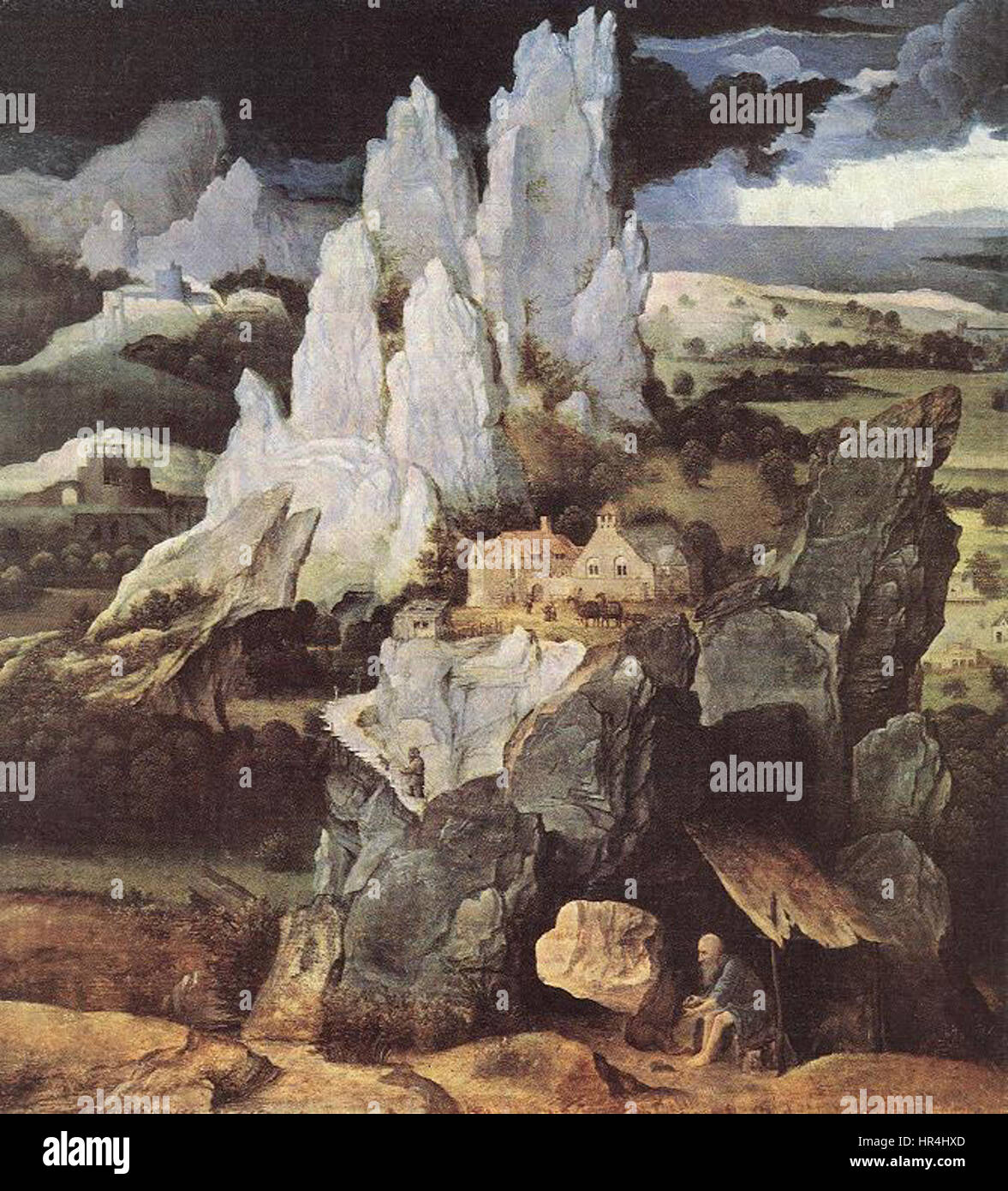 "St. Jerome in Rocky Landscape" di Joachim Patinir cattura St. Jerome nel suo rifugio accademico, circondato da un paesaggio spettacolare. Il dipinto fonde temi religiosi con raffigurazioni naturalistiche, tipiche delle composizioni paesaggistiche di Patinir. Foto Stock