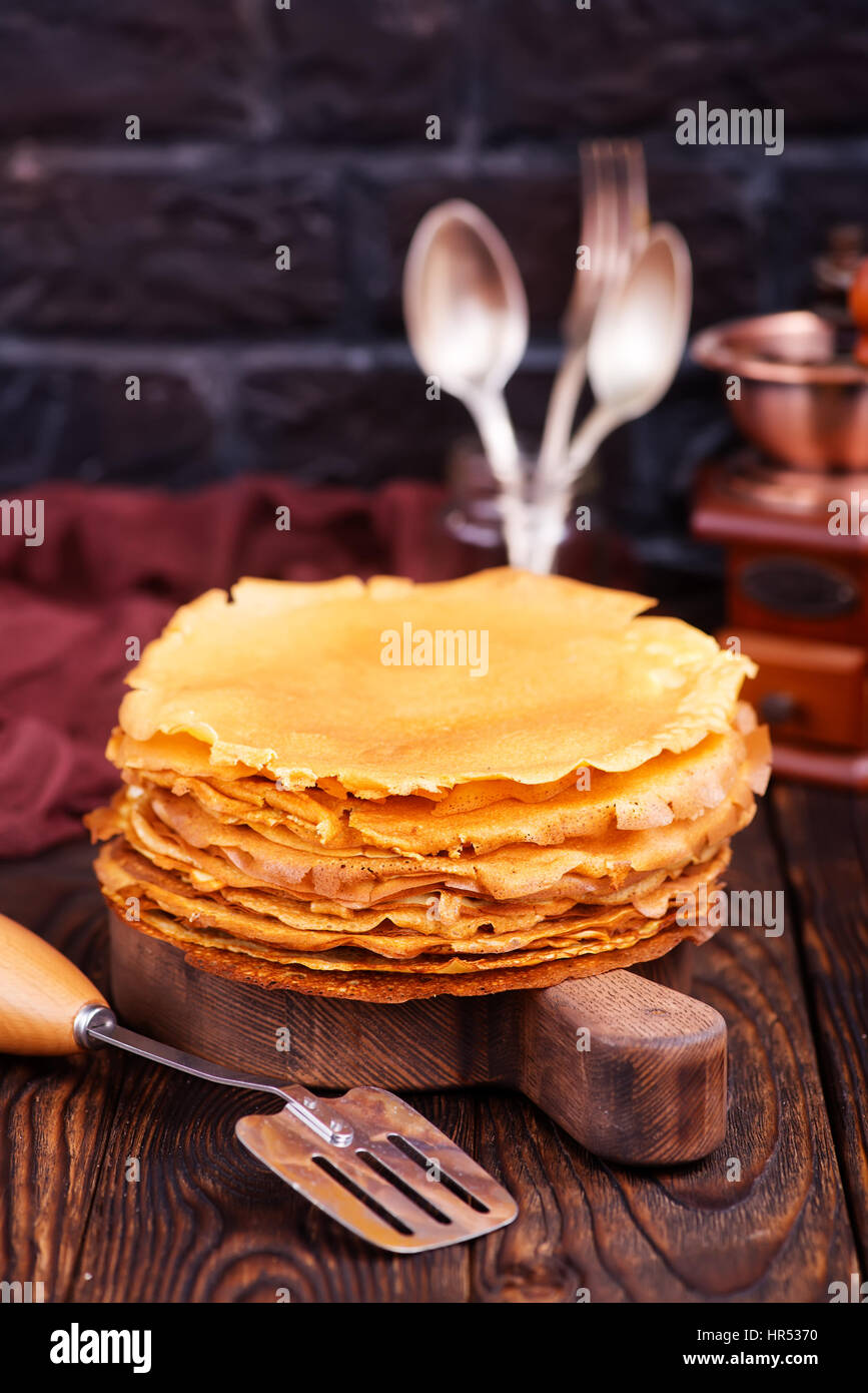 Il miele sulla piastra e su una tavola Foto Stock